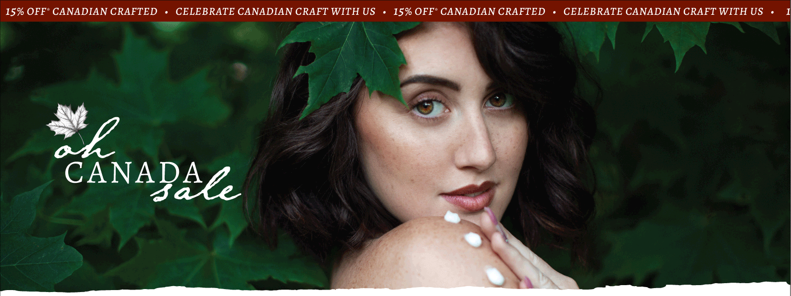 Brunette person with leaf on head and dots of lotion on arm with blurred background. Text overlay reads 'oh Canada Sale' and 'Celebrate Canadian craft with us - 15% off* Canadian crafted' on red banner. 