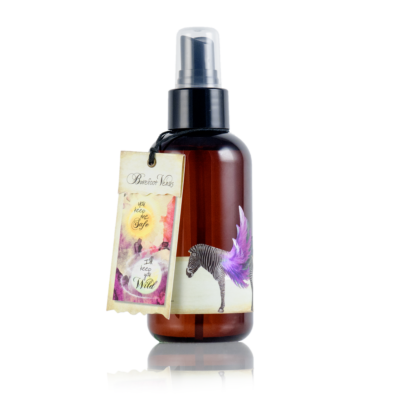 A mini spray bottle of Barefoot Venus Black Coconut Argan body oil with a floral zebra design on the packaging.