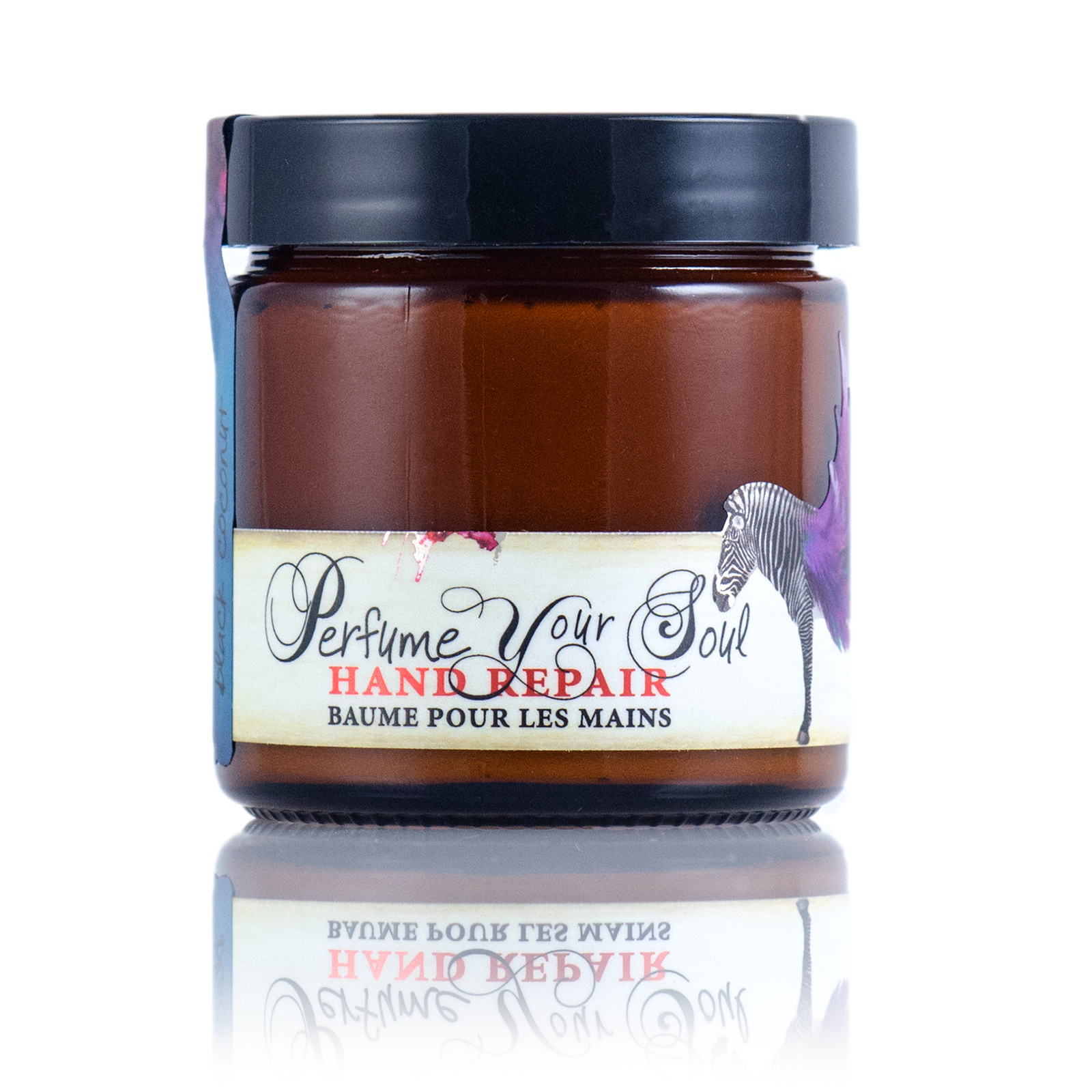 A mini tube of Barefoot Venus Black Coconut instant hand repair with a floral zebra design on the packaging.